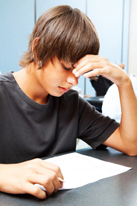 Boy working hard on his revision
