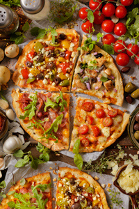 A pizza cut into four quarters