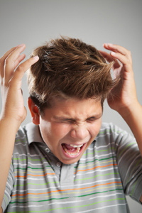Teenage boy upset because he is tired
