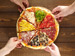 A pizza cut into eight pieces.