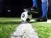 A footballer's boot about to kick a ball