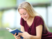 Happy teenage girl reading