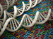 DNA strands lying on a bed of letters