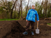 Child helping in garden with a spade