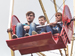 Child and parents on big wheel