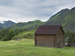 Wooden cabin beside mountains