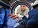 Man loading washing machine