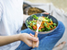 Boy eating salad